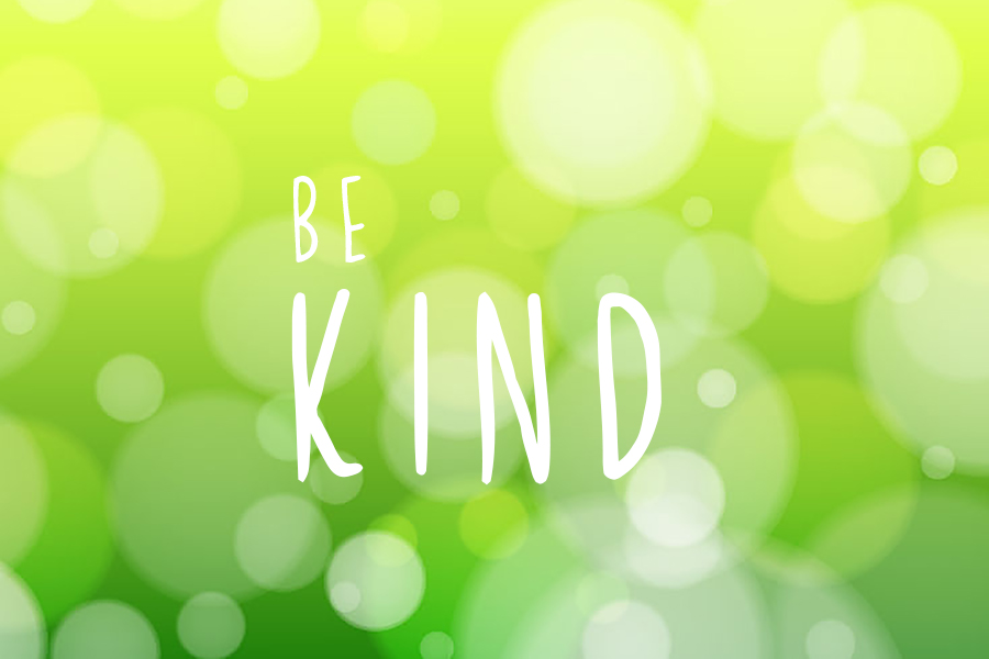 Green blurred abstract bokeh background with 'Be Kind' quote