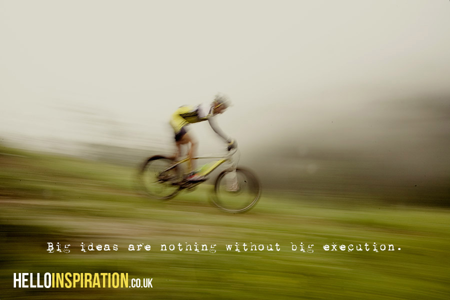 Speeding mountain biker with 'Big Ideas Are Nothing Without Big Execution' quote