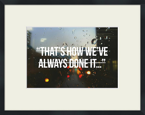 Raindrops on a window with 'That's How We've Always Done It' quote in a crossed out font